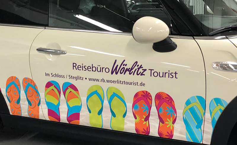 Autofolierung für das Reisebüro Wörlitz Tourist auf einem BMW Mini / Ansicht Beifahrerseite